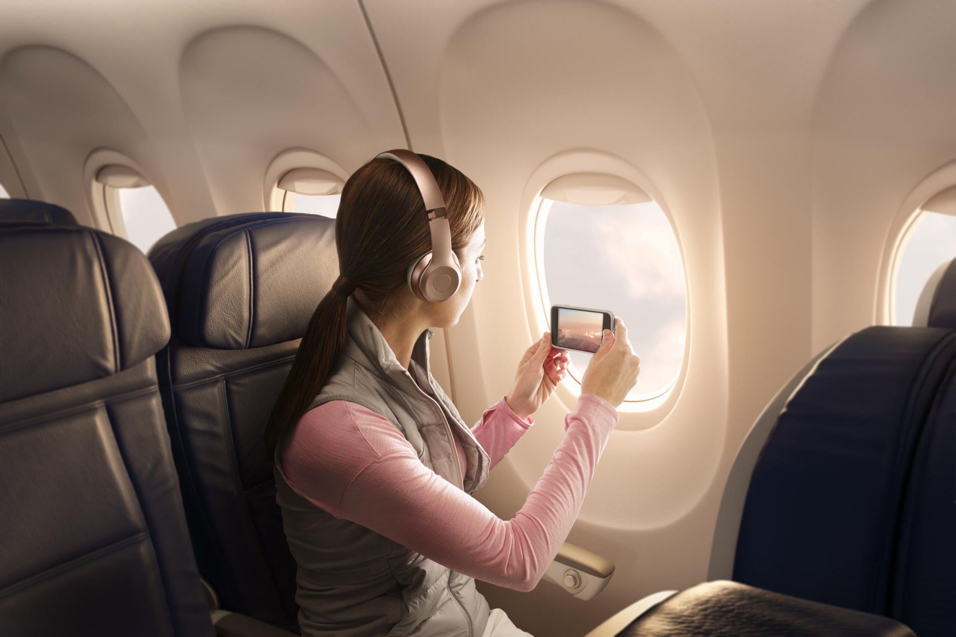 Delta passenger taking photo on phone