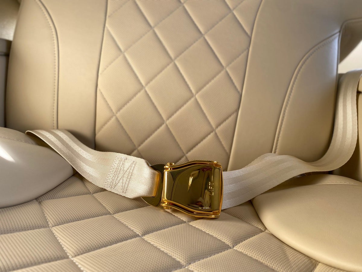Emirates A380 retrofit first class gold seatbelt