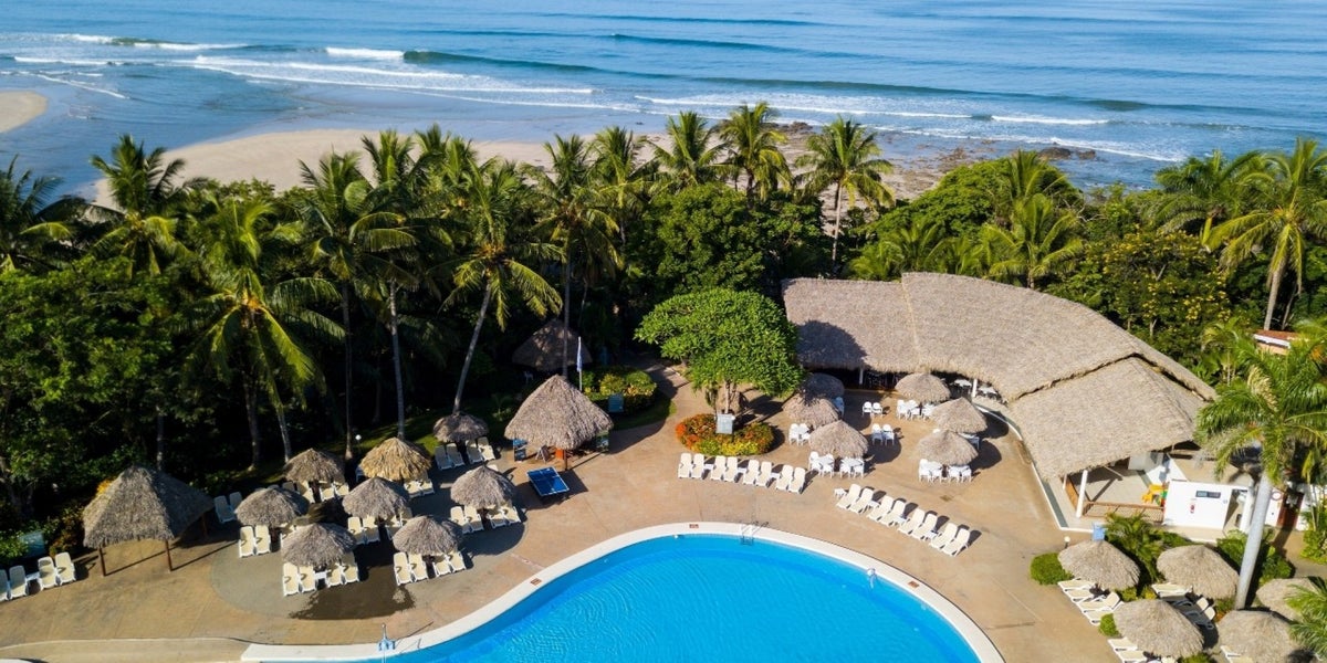 Aerial view of the pool and beach at Occidental Tamarindo.