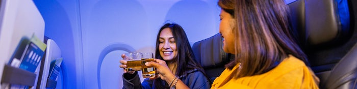 Alaska seatmates toasting