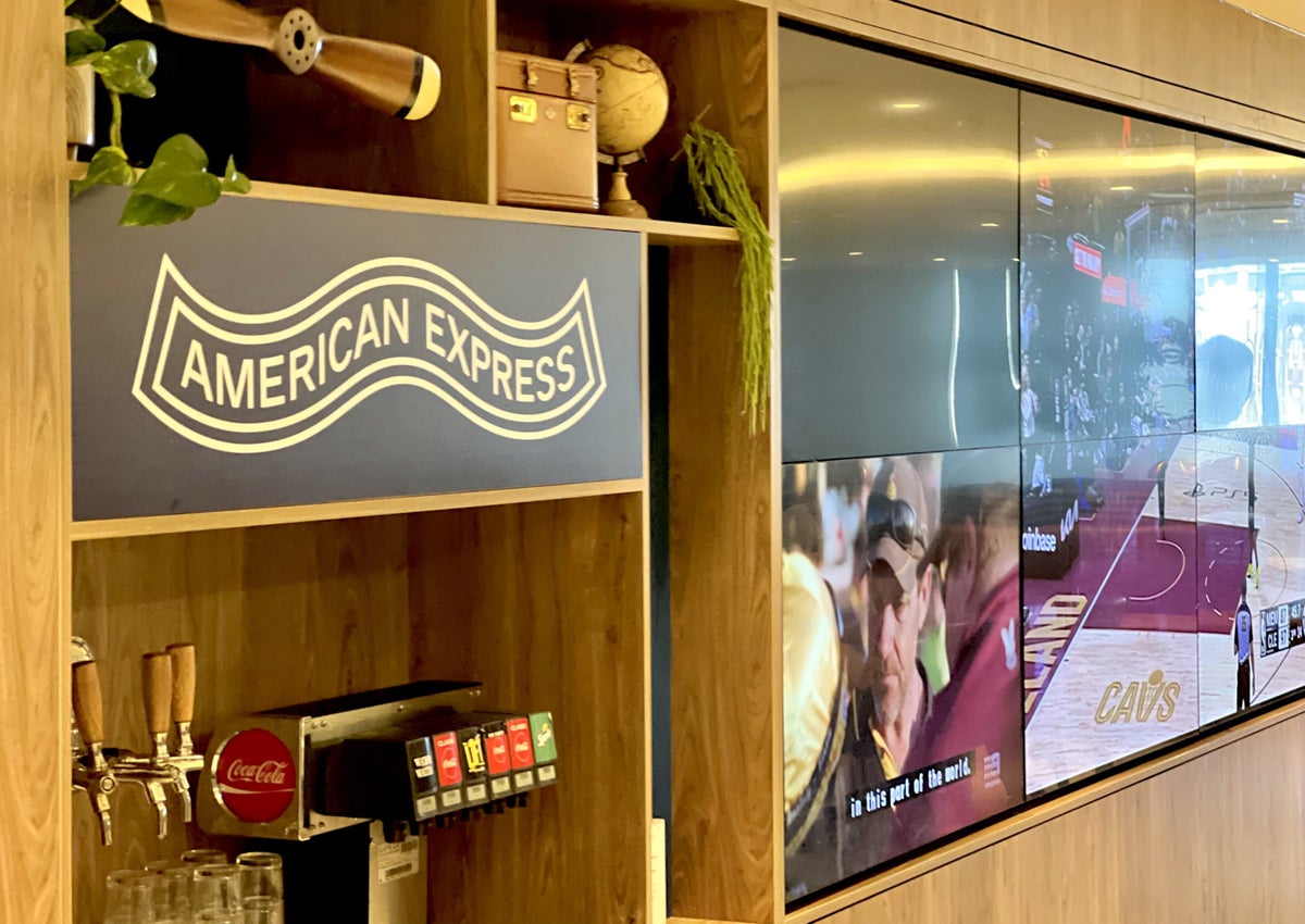American Express Centurion Lounge Sydney sign and TV