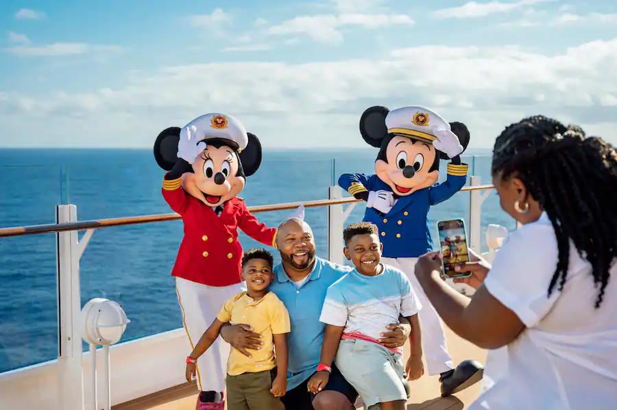 Family getting photo taken on Disney Cruise