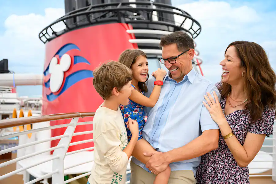 Family smiling on Disney cruise