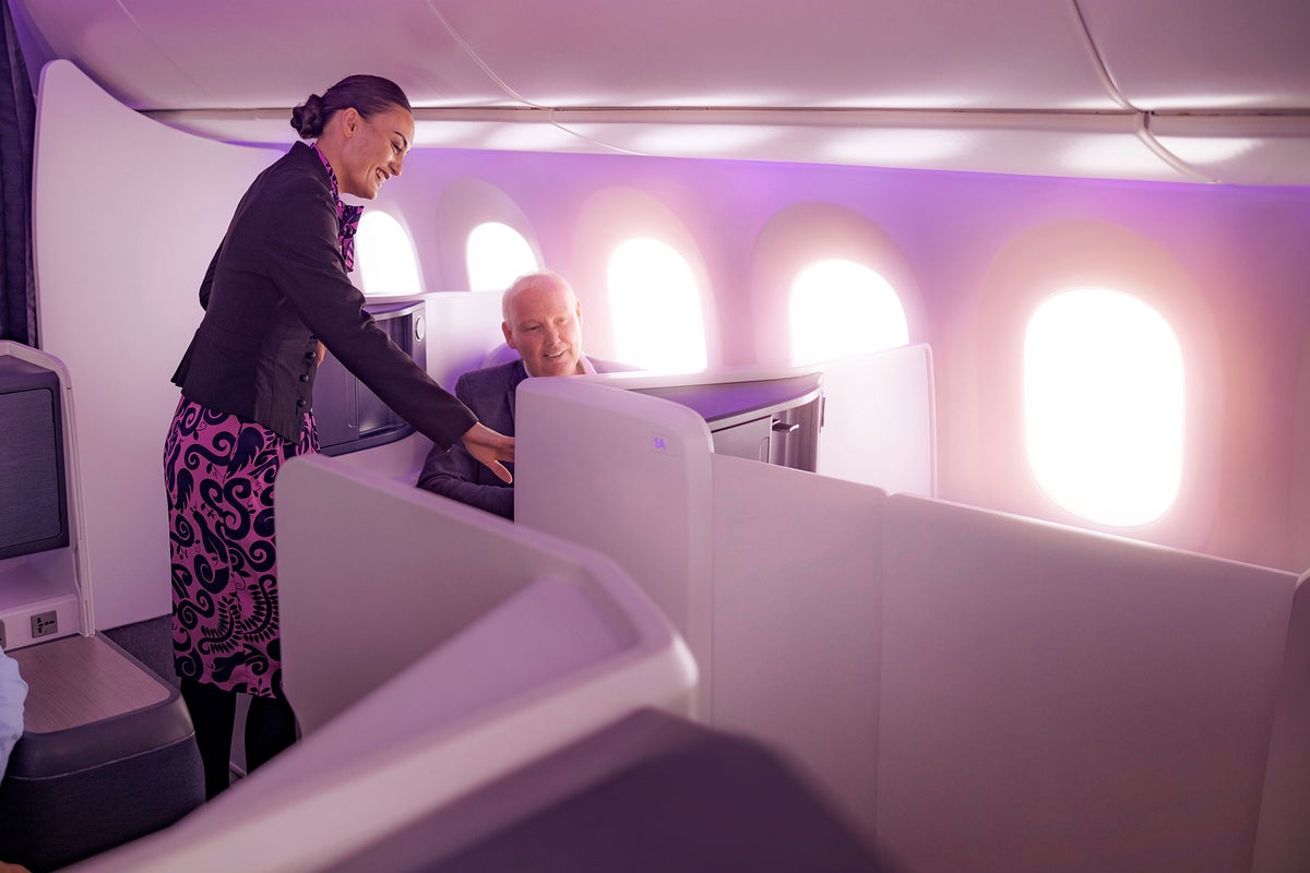 Air New Zealand business passenger and flight attendant