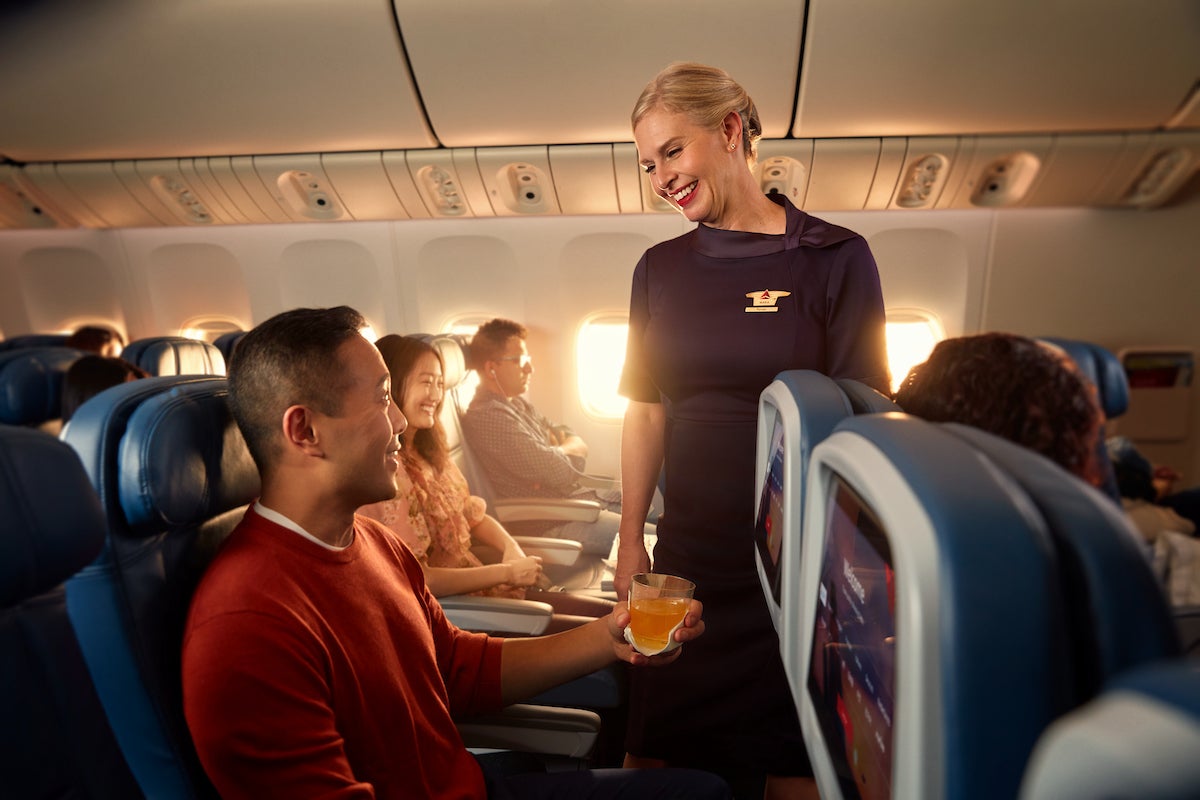 Delta flight attendant and passenger