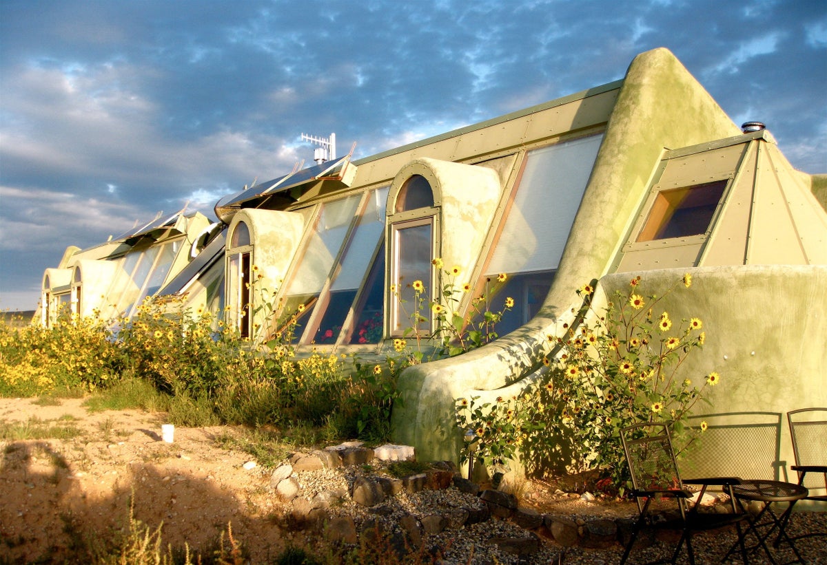 An image of the exterior of an Earthship home