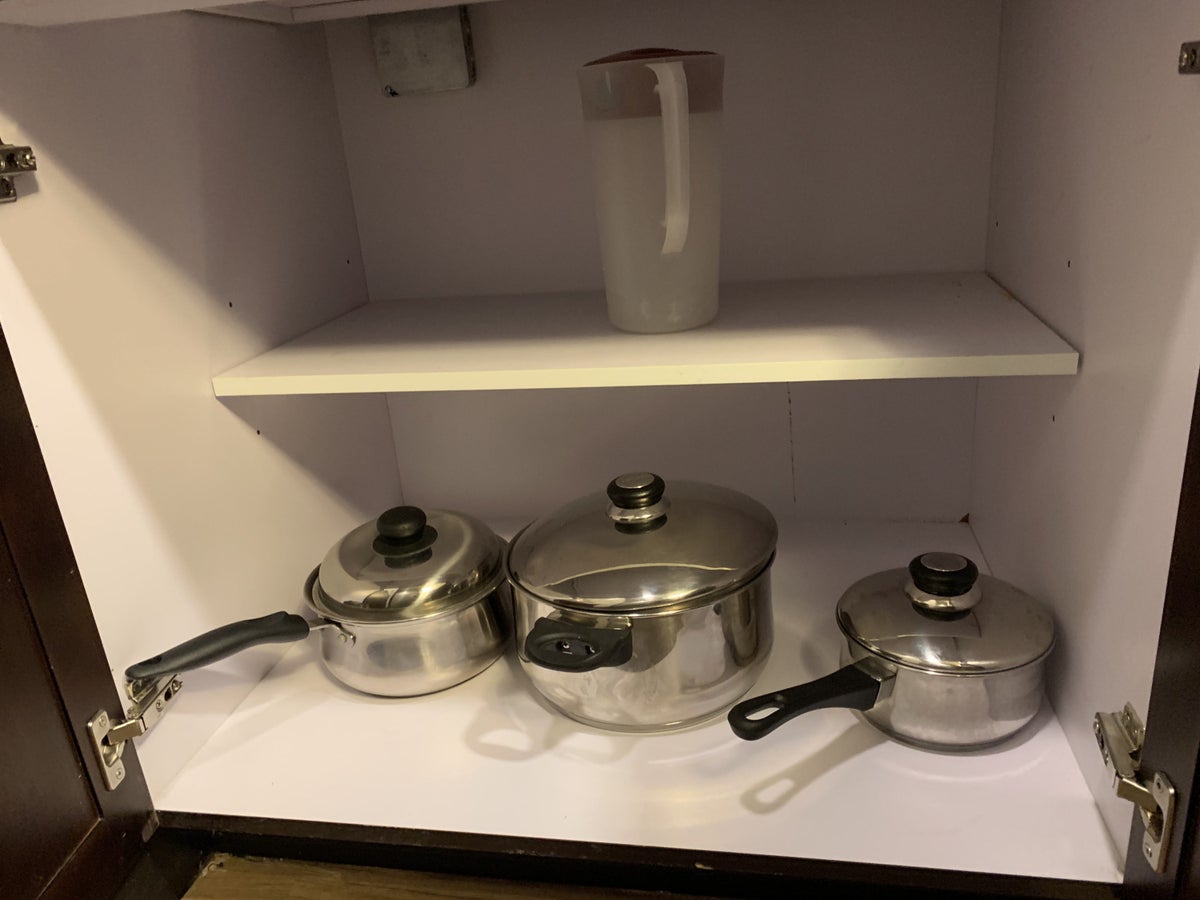 Pots pans and a drink jug in the guestroom at Homewood Suites Austin Round Rock
