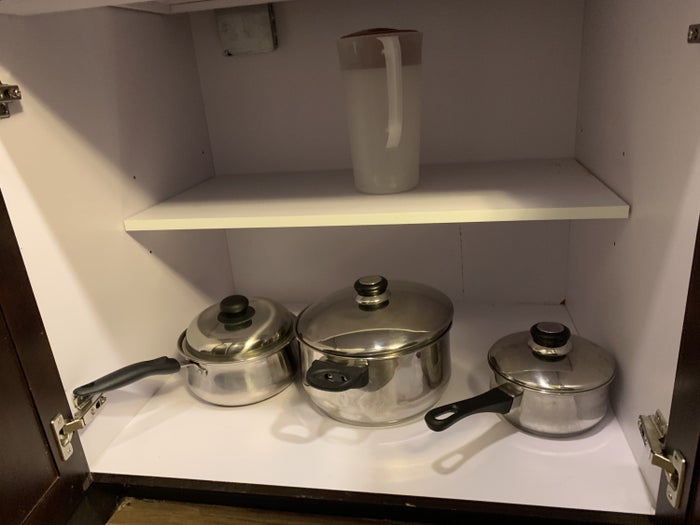 Pots pans and a drink jug in the guestroom at Homewood Suites Austin Round Rock