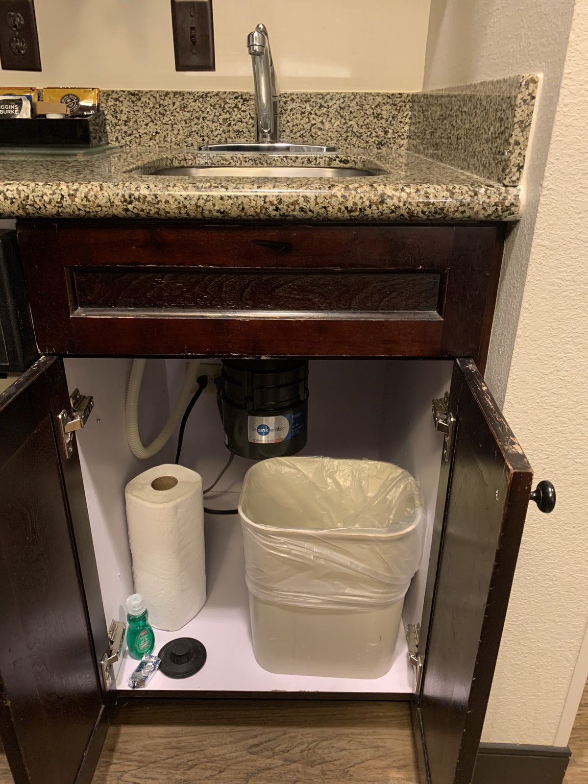 Traah can under the sink in the guestroom kitchen at Homewood Suites Austin Round Rock
