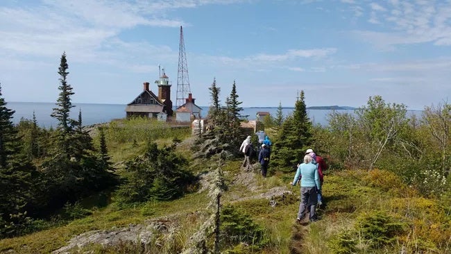 Visitors Hike on Passage Island