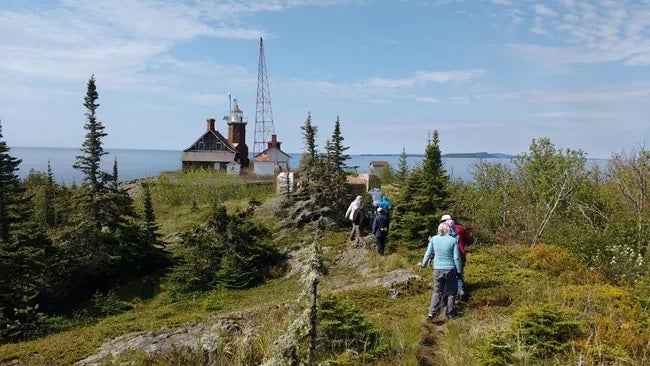 Visitors Hike on Passage Island
