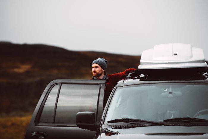 Man standing next to car