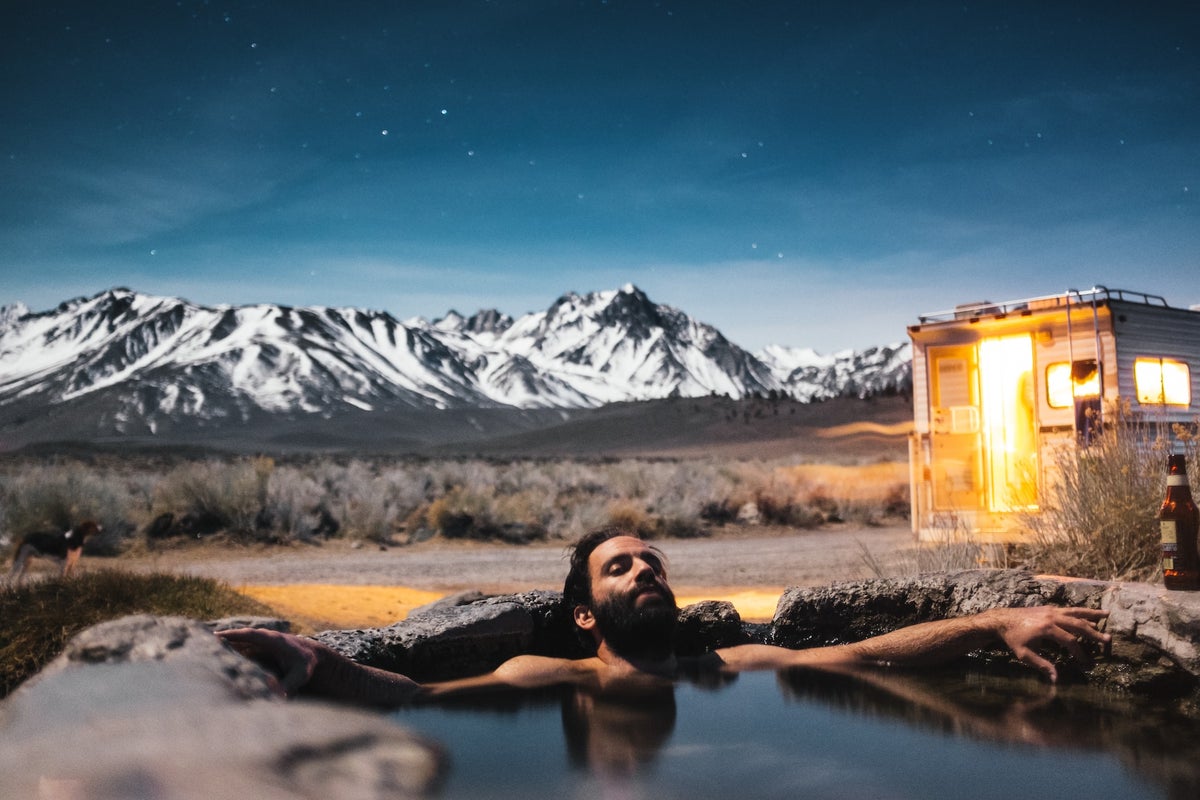 Mountains and man in a pool