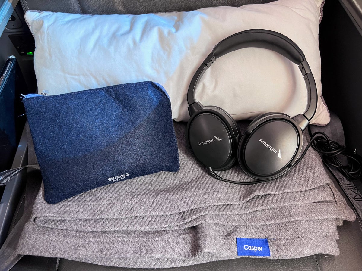 AA Premium Economy amenity kit headphones pillow and blanket