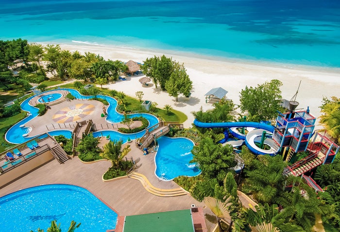 An aerial photo of the water slides and pool at Beaches Negril. An aerial photo of the water slides and pool at Beaches Negril.