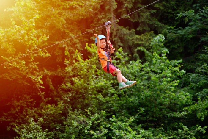 Boy ziplining Boy ziplining