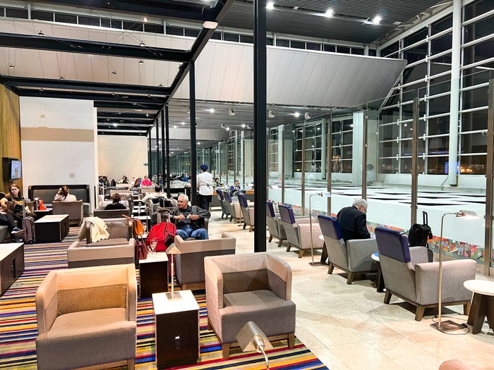 Chair overlooking terminal at LATAM VIP Lounge GRU Chair overlooking terminal at LATAM VIP Lounge GRU