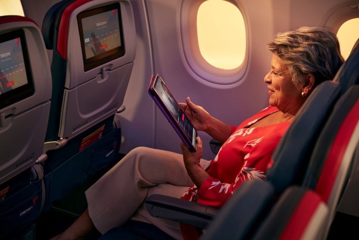 Woman using tablet on Delta plane