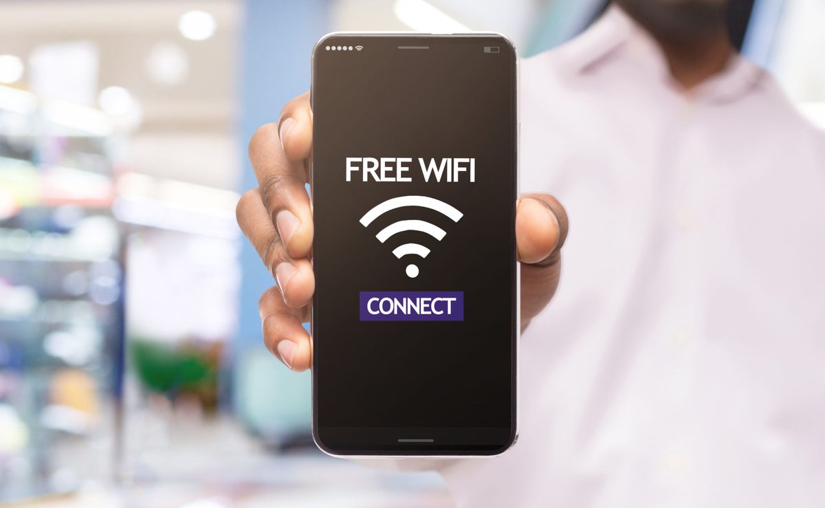 Free Wi Fi man holding phone