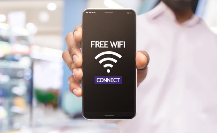 Free Wi Fi man holding phone Free Wi Fi man holding phone