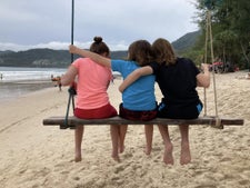 My kids enjoying a swing at Patong Beach in Phuket, Thailand.