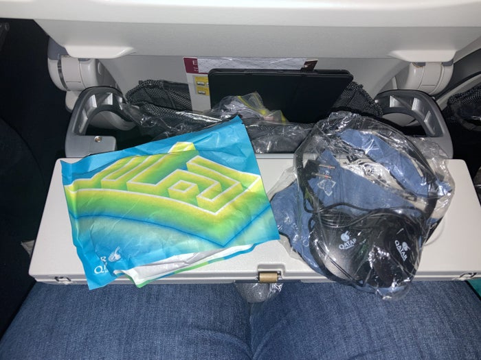 Qatar Airways 777 DOH DFW economy amenity kit headphones Qatar Airways 777 DOH DFW economy amenity kit headphones