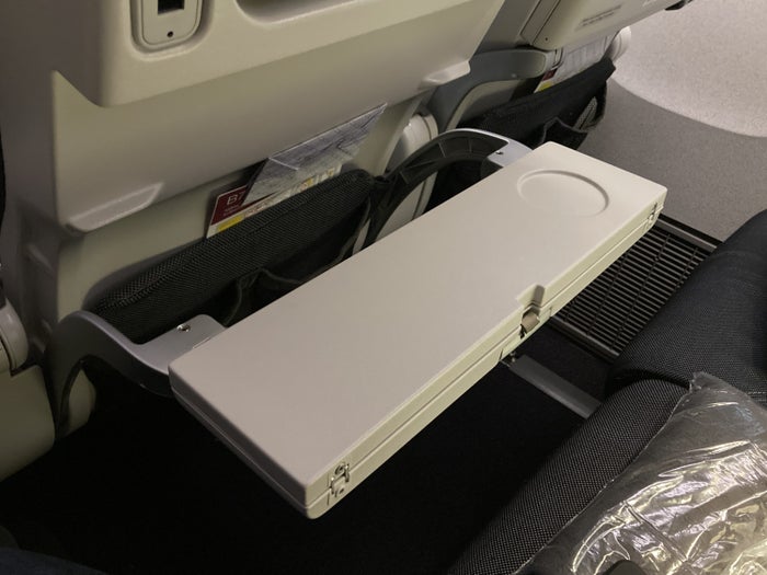 Qatar Airways 777 DOH DFW economy half tray table Qatar Airways 777 DOH DFW economy half tray table