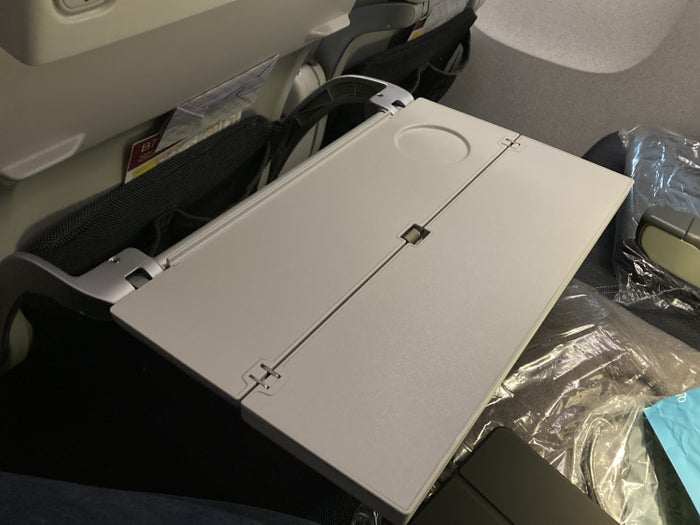 Qatar Airways 777 DOH DFW economy opened tray table Qatar Airways 777 DOH DFW economy opened tray table