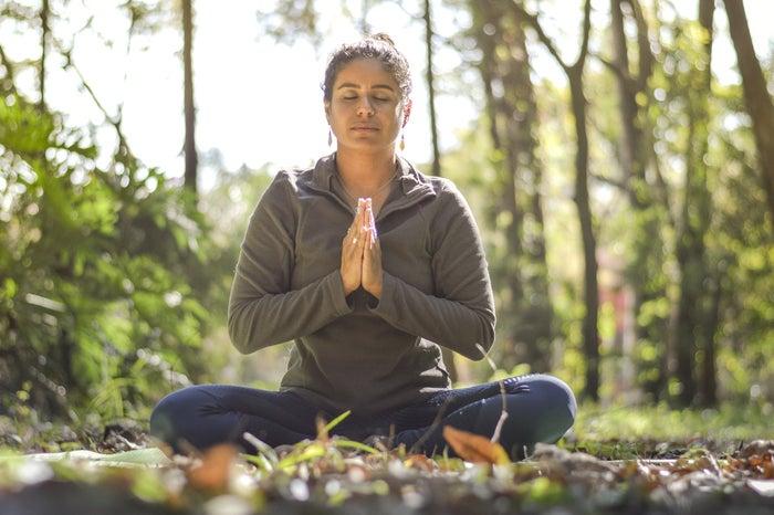 Woman doing yoga A woman does yoga on a wellness retreat.