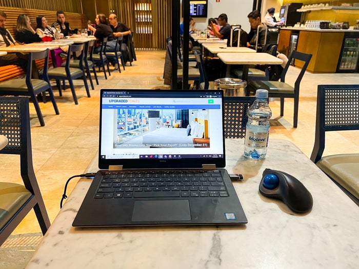 laptop and water at LATAM VIP Lounge GRU laptop and water at LATAM VIP Lounge GRU