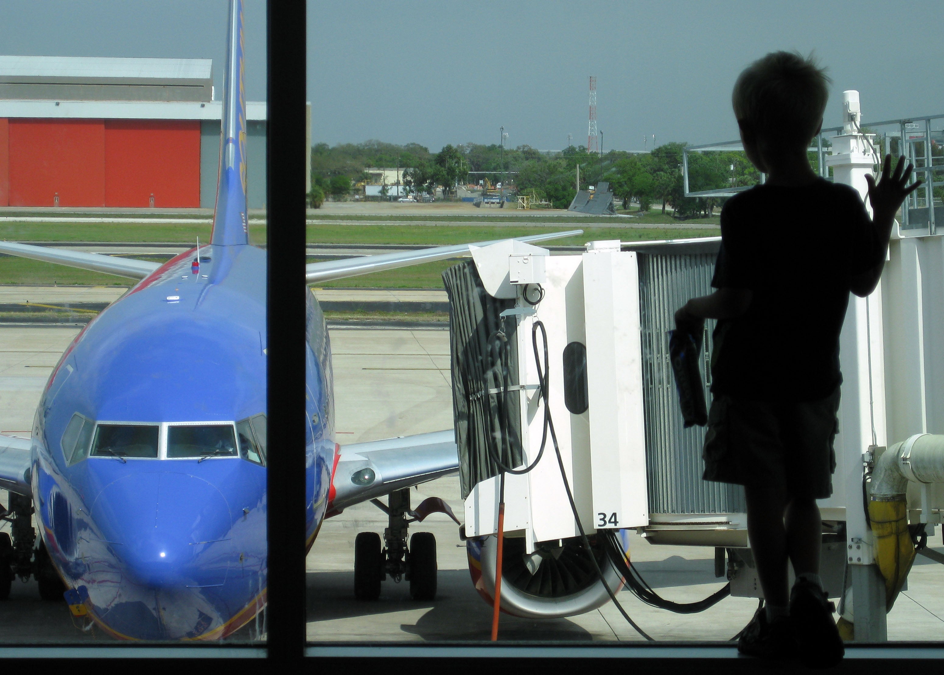 Southwest Point Redemptions Will Now Cost 4 More In 2024   Boy Looking At Southwest Airlines Plane 