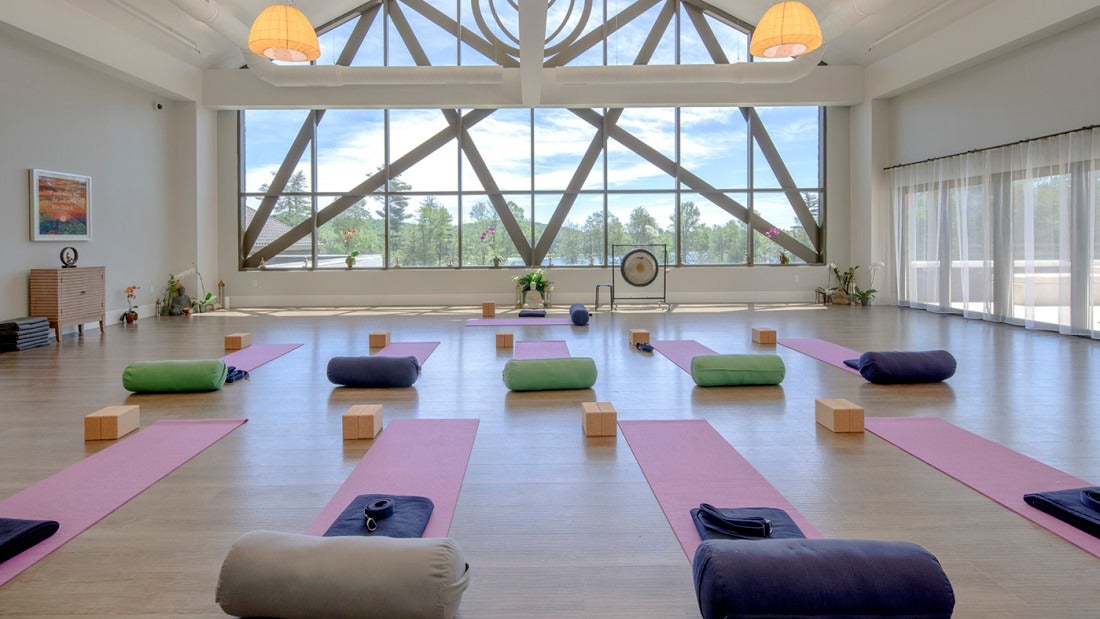 Yoga at Yo1 in a bright studio with windows