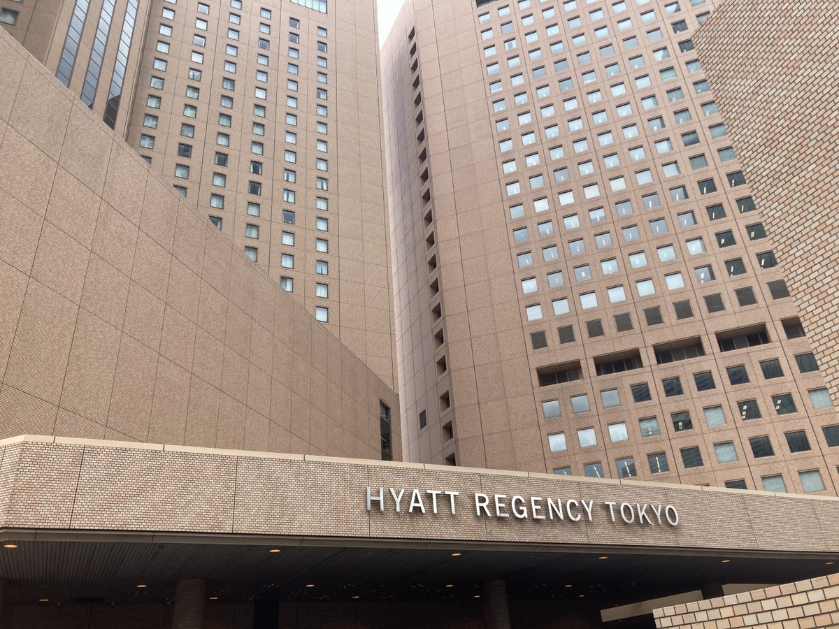 Hyatt Regency Tokyo sign looking up at towers