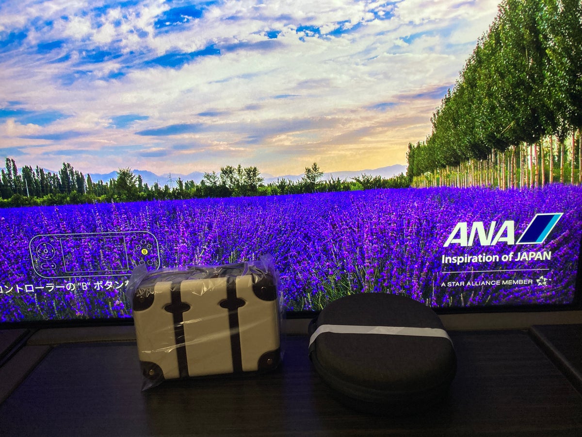 ANA new first class suites HND SFO Boeing 777 TV headphones amenity kit