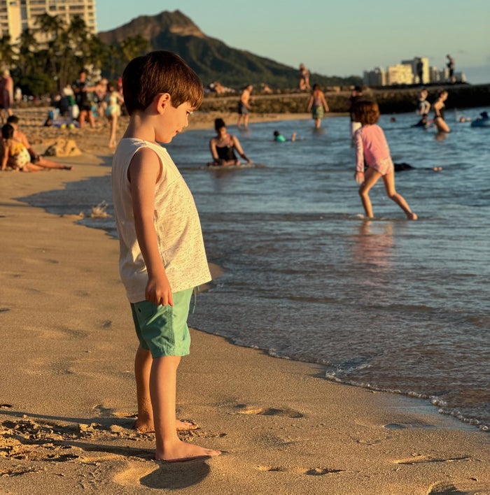Boy on Waikiki Beach Honolulu Hawaii Boy on Waikiki Beach Honolulu Hawaii