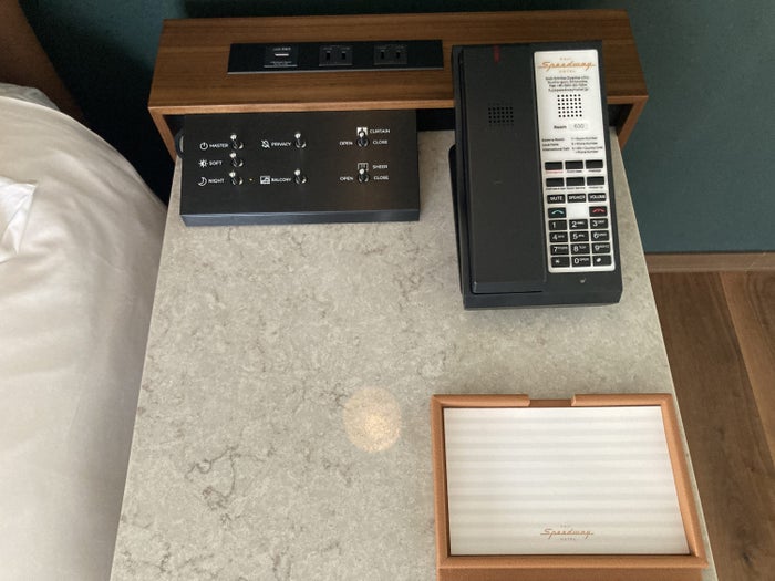 Fuji Speedway Hotel Grand Prix Corner King Suite bedroom night stand notepad controls phone Fuji Speedway Hotel Grand Prix Corner King Suite bedroom night stand notepad controls phone