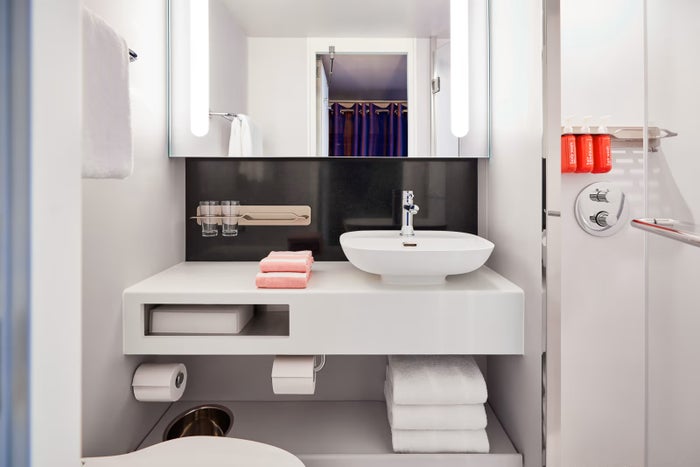 Virgin Voyages Bathroom 1 Rendering of a bathroom in a Virgin Voyages cabin