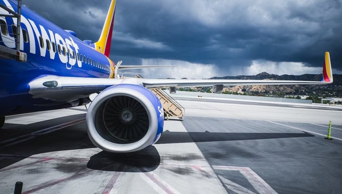 Southwest Airlines Plane with Storm in Background Southwest Airlines Plane with Storm in Background