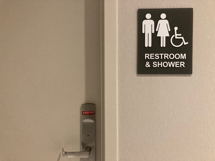 The Club LAS lounge restroom shower sign