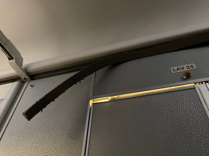 Air France Boeing 777 200 CDG JFK premium economy insulation above lavatory door Air France Boeing 777 200 CDG JFK premium economy insulation above lavatory door