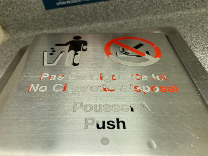 Air France Boeing 777 200 CDG JFK premium economy lavatory worn trash bin lid Air France Boeing 777 200 CDG JFK premium economy lavatory worn trash bin lid