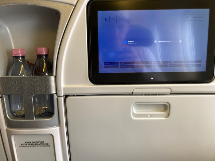 Air France Boeing 777 200 CDG JFK premium economy seat back with screen and water Air France Boeing 777 200 CDG JFK premium economy seat back with screen and water