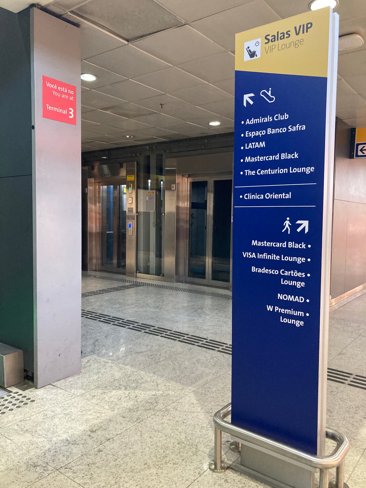 American Express Centurion Lounge Sao Paulo GRU sign near escalators