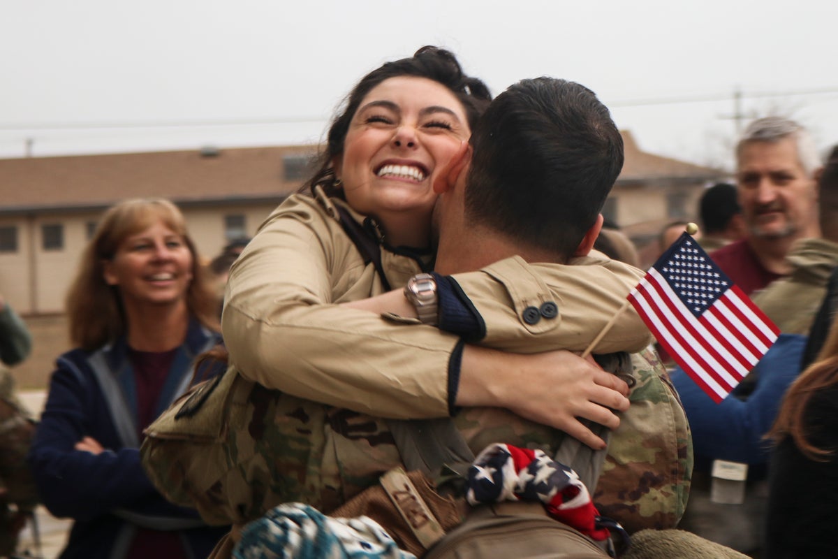 Military Member Hugging Woman