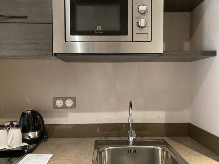 Radisson Serviced Apartments Antananarivo kitchenette sink and microwave Radisson Serviced Apartments Antananarivo kitchenette sink and microwave