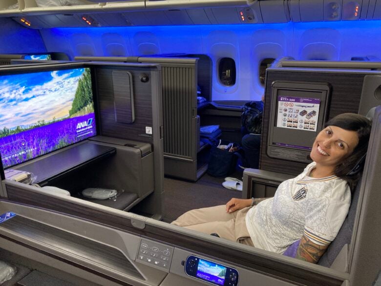 A woman relaxes in ANA's first-class suite before takeoff