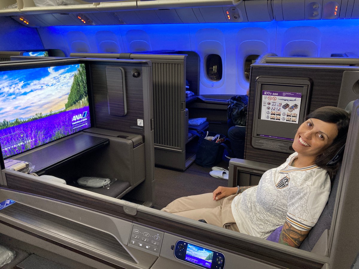 A woman relaxes in ANA's first-class suite before takeoff