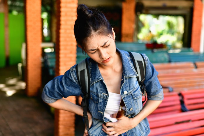 LifeStraw Personal Water Filter for Hiking Women traveler experiencing stomach pain