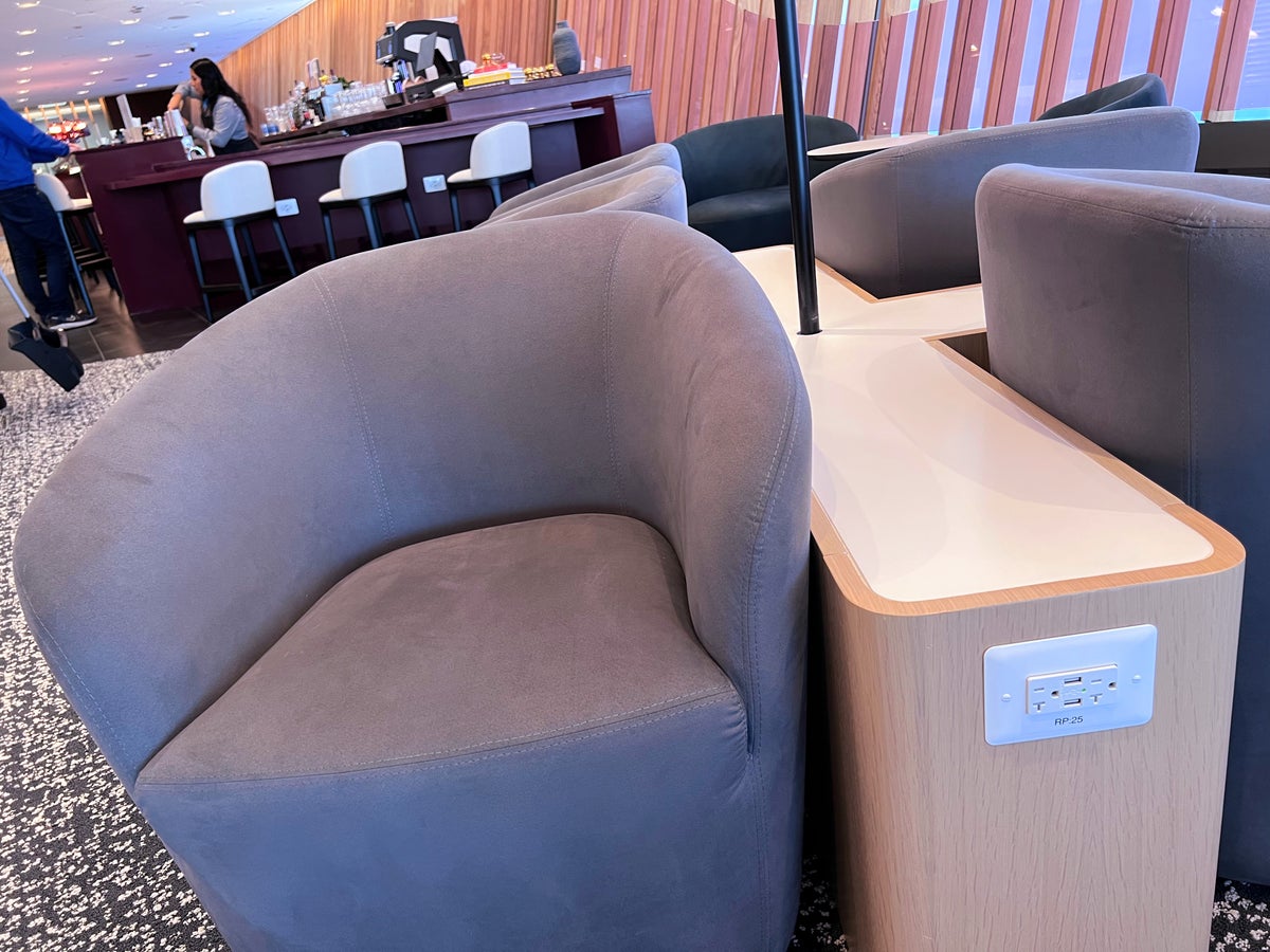Chair and outlets at Capital One Lounge IAD