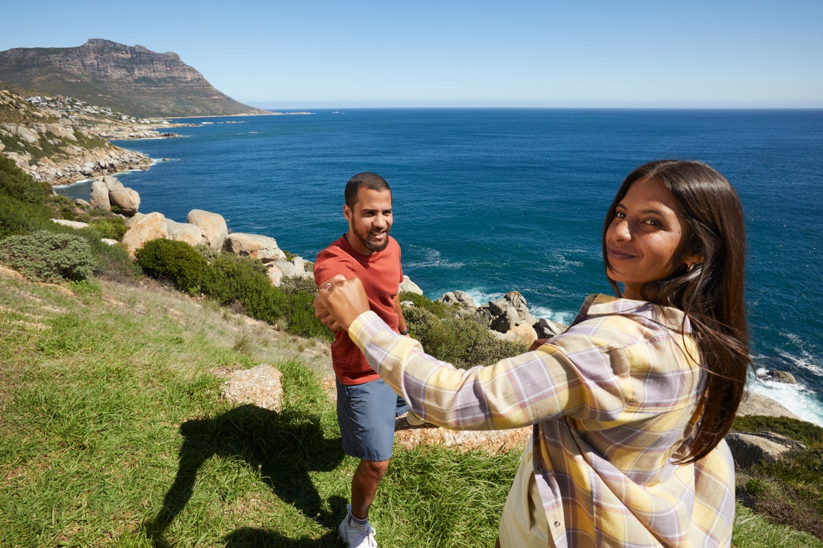 Couple at grassy cliff